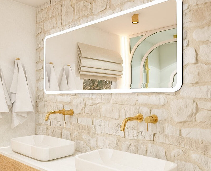 Salle de bain plan vasque en béton ciré, miroir hight tech lumineux, mur pierre à Toulouse